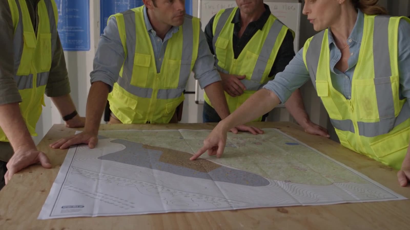 A team planning over a site map