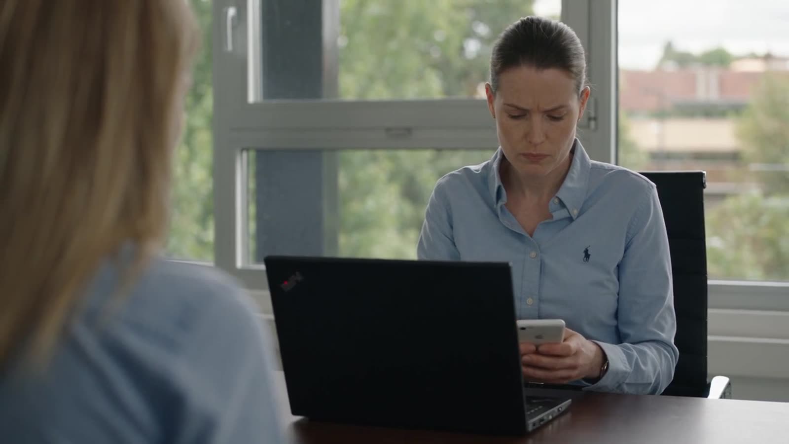 Safety manager reviewing data at a laptop